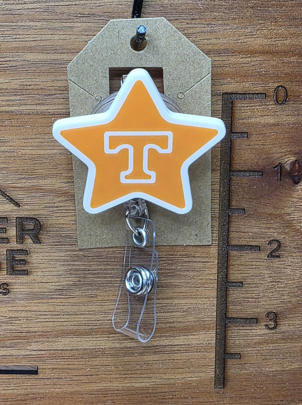 Star Badge Reel - Orange Star with 'T'